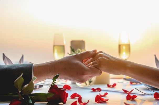 Anniversary theme with two hands toasting